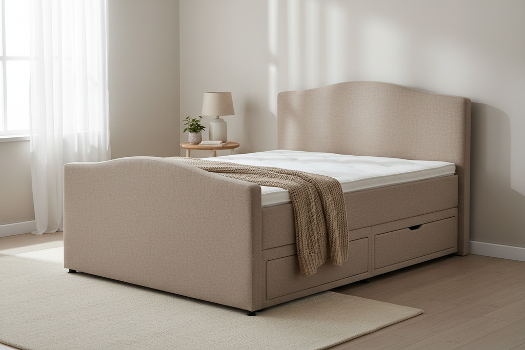 Mink divan bed side angle showing curved headboard and drawer storage