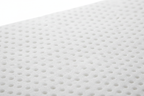 Natural latex topper close-up showing pinhole texture