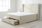 Cream wingback divan bed side angle showing drawer storage open