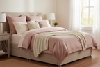 Mink divan bed lifestyle, styled with blush and cream bedding, bright neutral bedroom