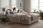 Linen ottoman bed lifestyle shot, person reading in bed, cosy morning light
