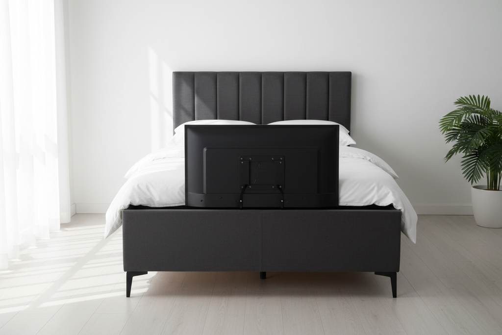 Charcoal chenille TV bed front view, motorised TV raised from footboard, white bedroom
